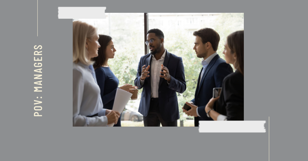 a manager surrounded with the employees 